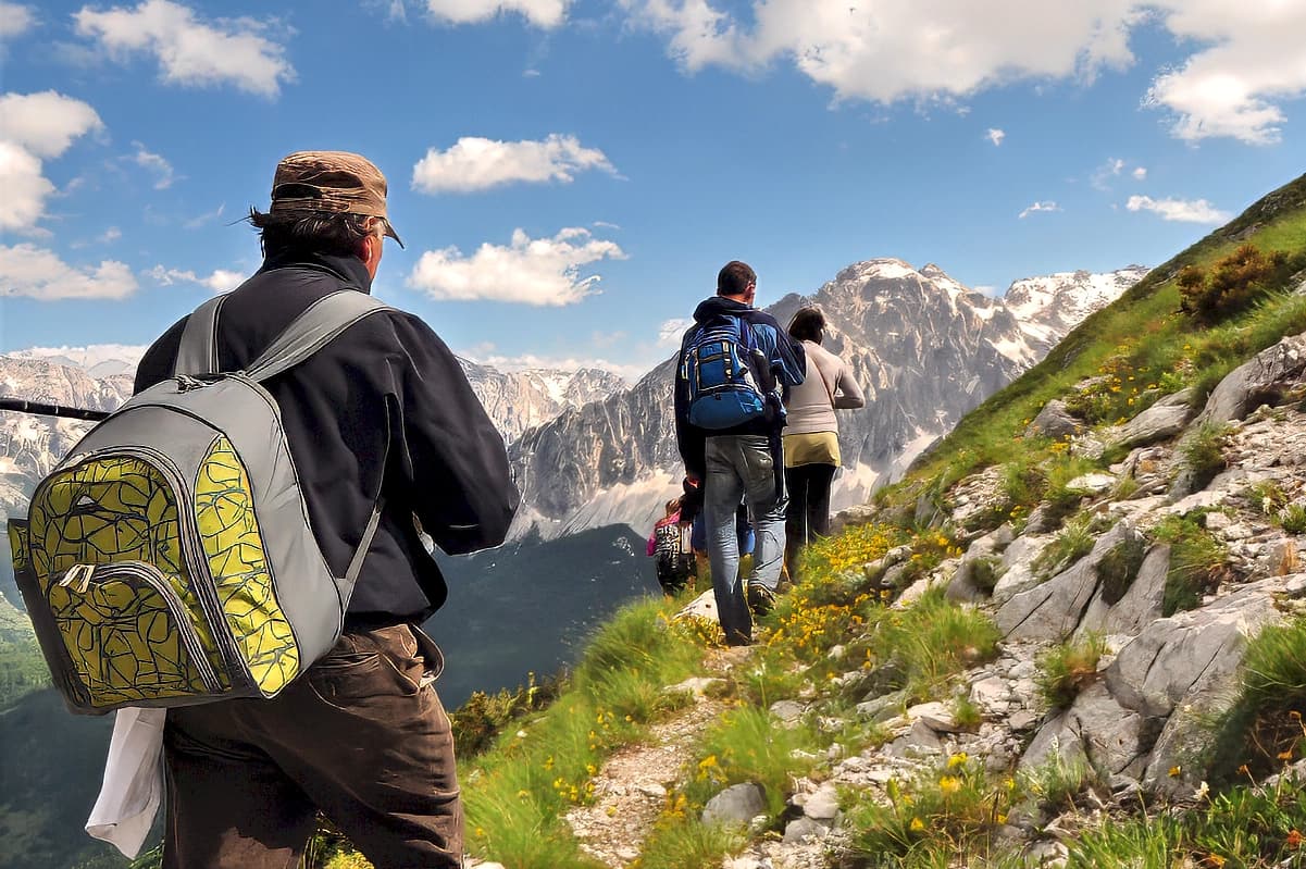 Sadik Malaj leading a walking group in the Albanian Alps
